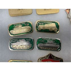 Nineteen Russian Soviet Tank Commemoration badges and medals, in small display case
