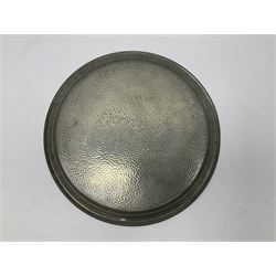Liberty & Co Tudric pewter three piece tea service, comprising teapot with woven reed handle, twin handled open sucrier, and milk jug, each of squat form with planished finish, each impressed beneath Tudric Pewter Ware 01537 Made in England, together with a matched unmarked tray