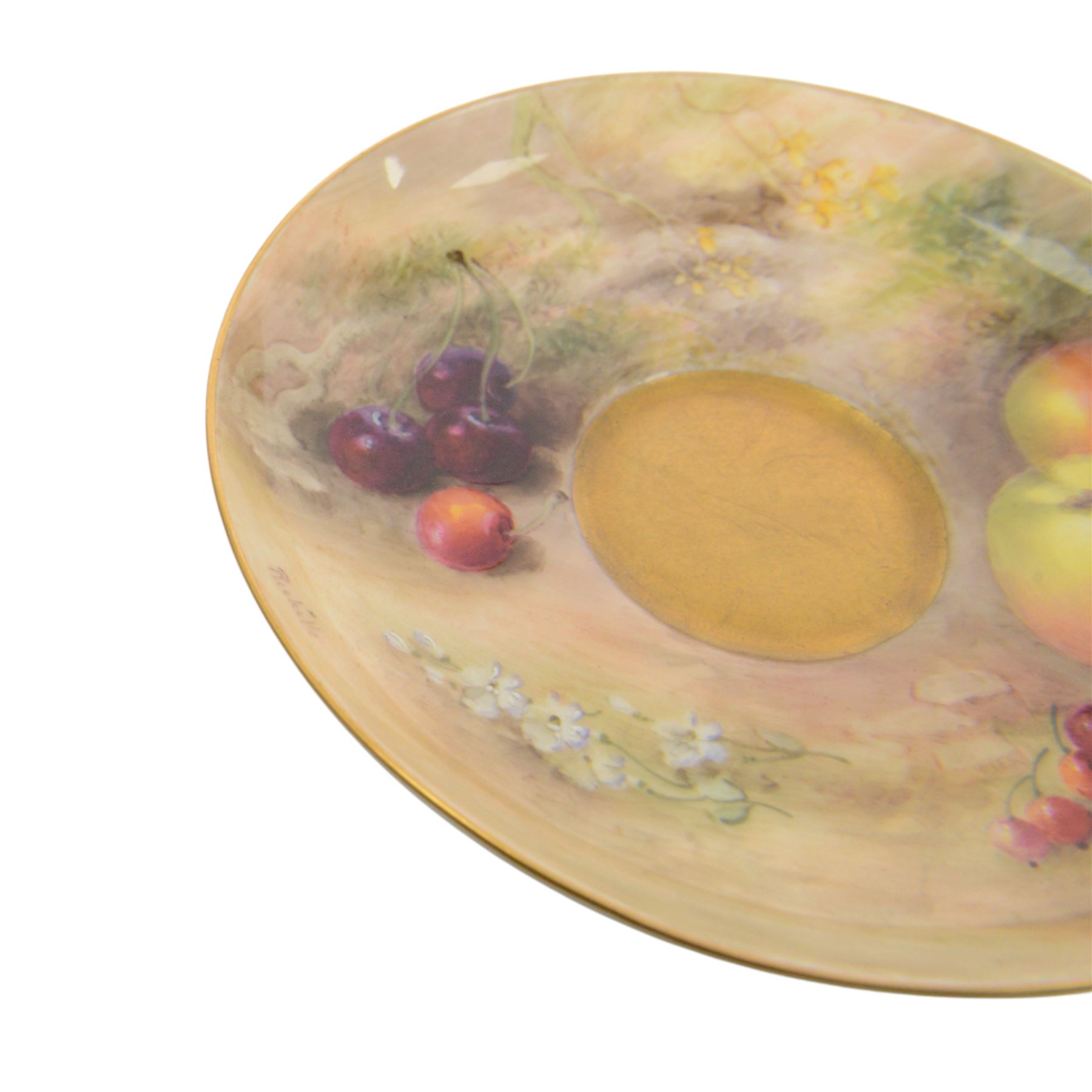 Royal Worcester fruit painted cabinet teacup and saucer, interior hand painted with apples, blackberry and cherries upon a mossy ground, the cup exterior and centre of saucer gilded, cup and saucer signed Rickells, each with puce coloured printed marks beneath, H7cm