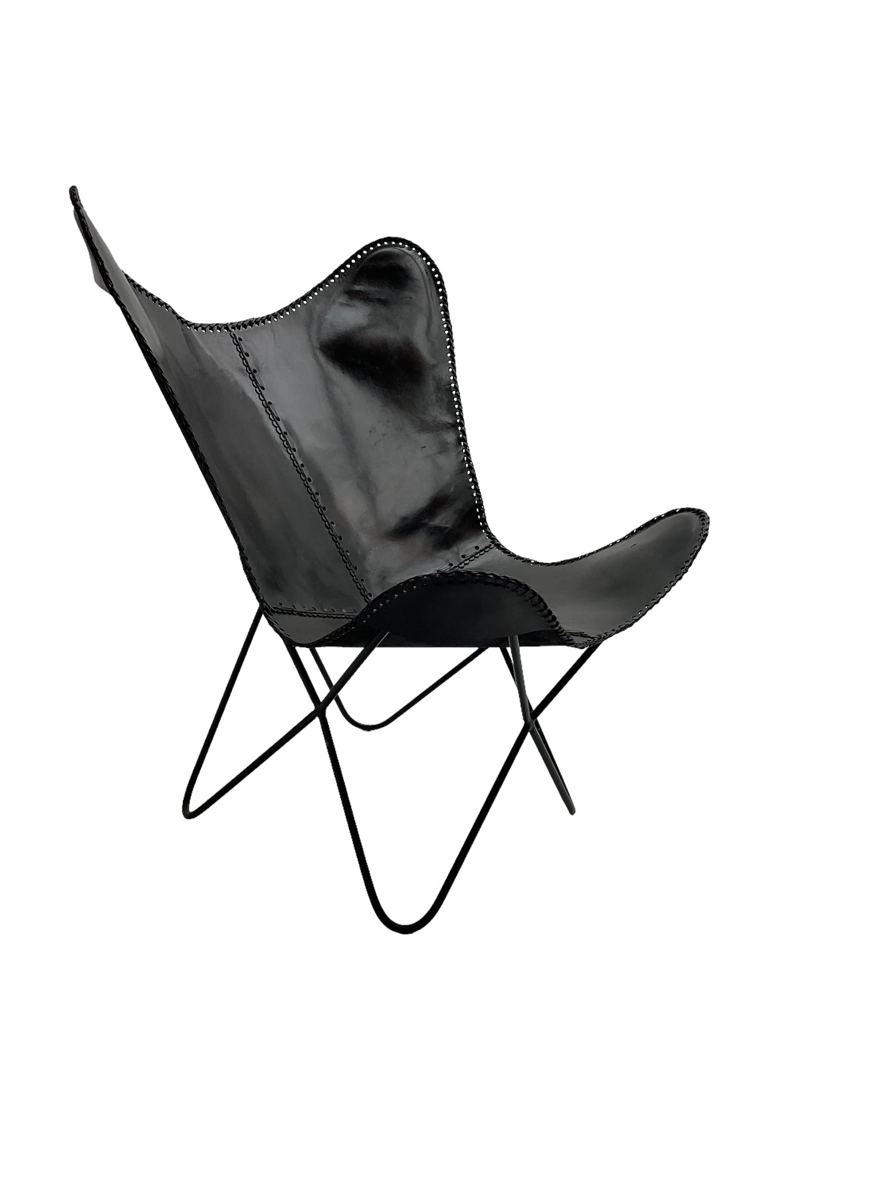 Butterfly Chair, black finish metal frame with stitched slung leather cover