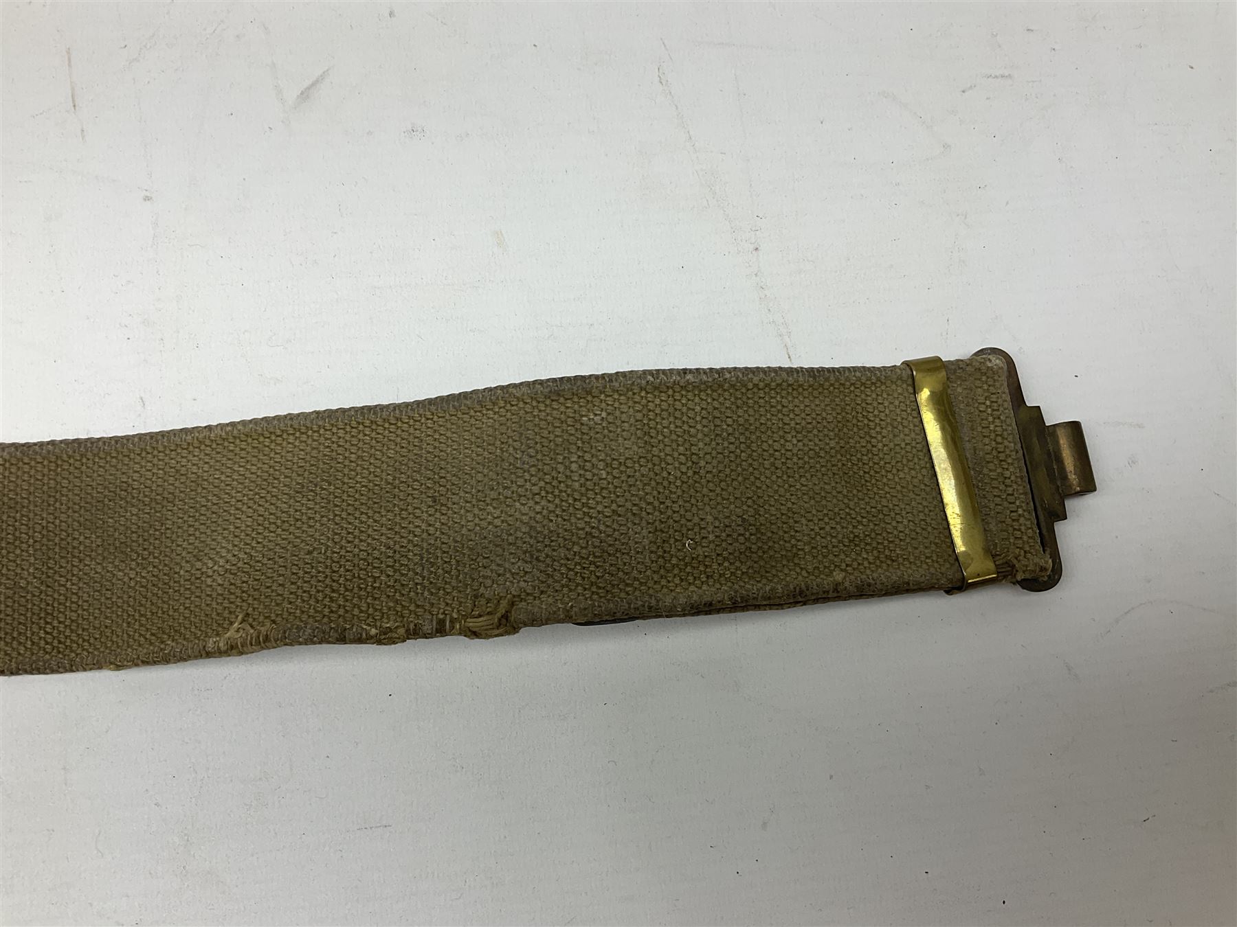 WW2 British black felt beret with Pioneer Corps cap badge, with Kangol Wear maker's mark dated 1943; and a British Army green webbing belt (2)