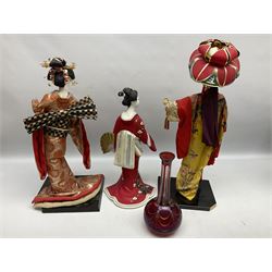 Three Japanese Geisha dolls figures, cut glass cranberry decanter (lacking lid) etc