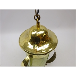  Arts and Crafts hammered brass dome top hall lantern, cylindrical vaseline glass shade and tapered strap work supports with circular embossed motif, H40cm (excluding chain)  