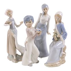 Two Lladro figures, Girl with Calla Lilies and Girl Feeding Goose, together with two other...