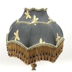 A composite gilt effect table lamp, with black shade embroidered with butterflies and finished with beaded tassels, overall H70cm.