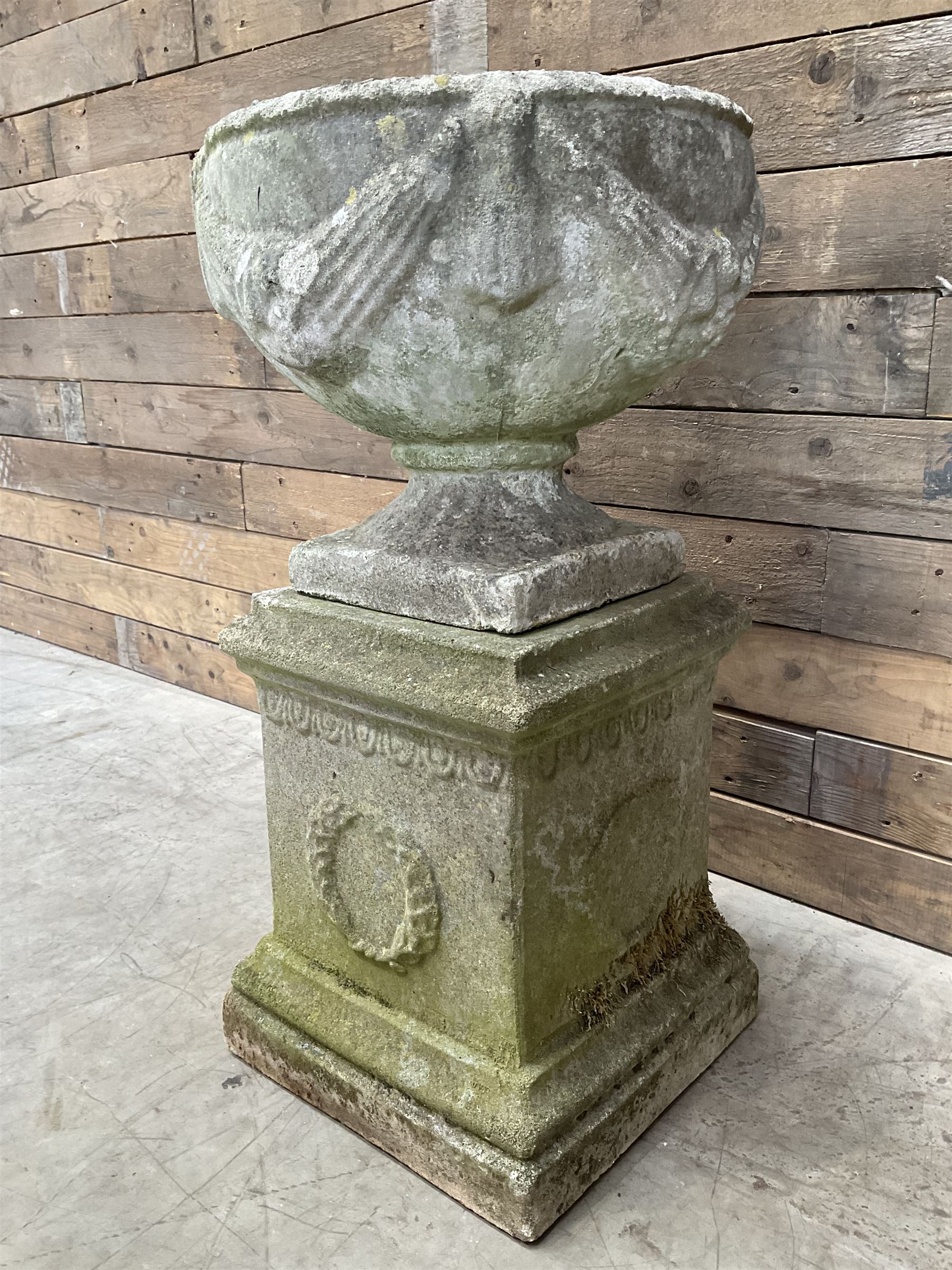 Cast stone centerpiece urn on plinth