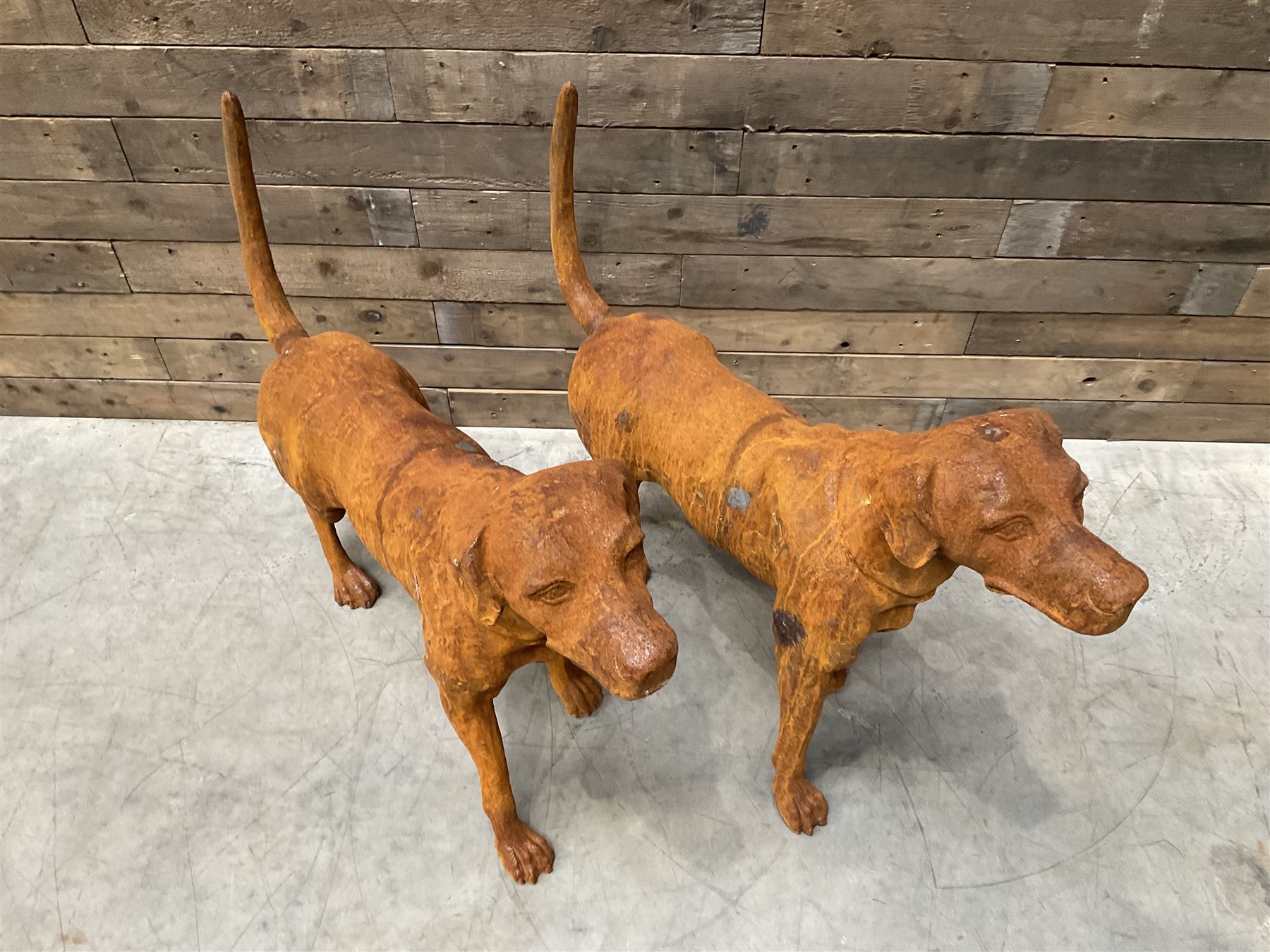 Pair of life-size heavy cast iron garden Hunting dogs