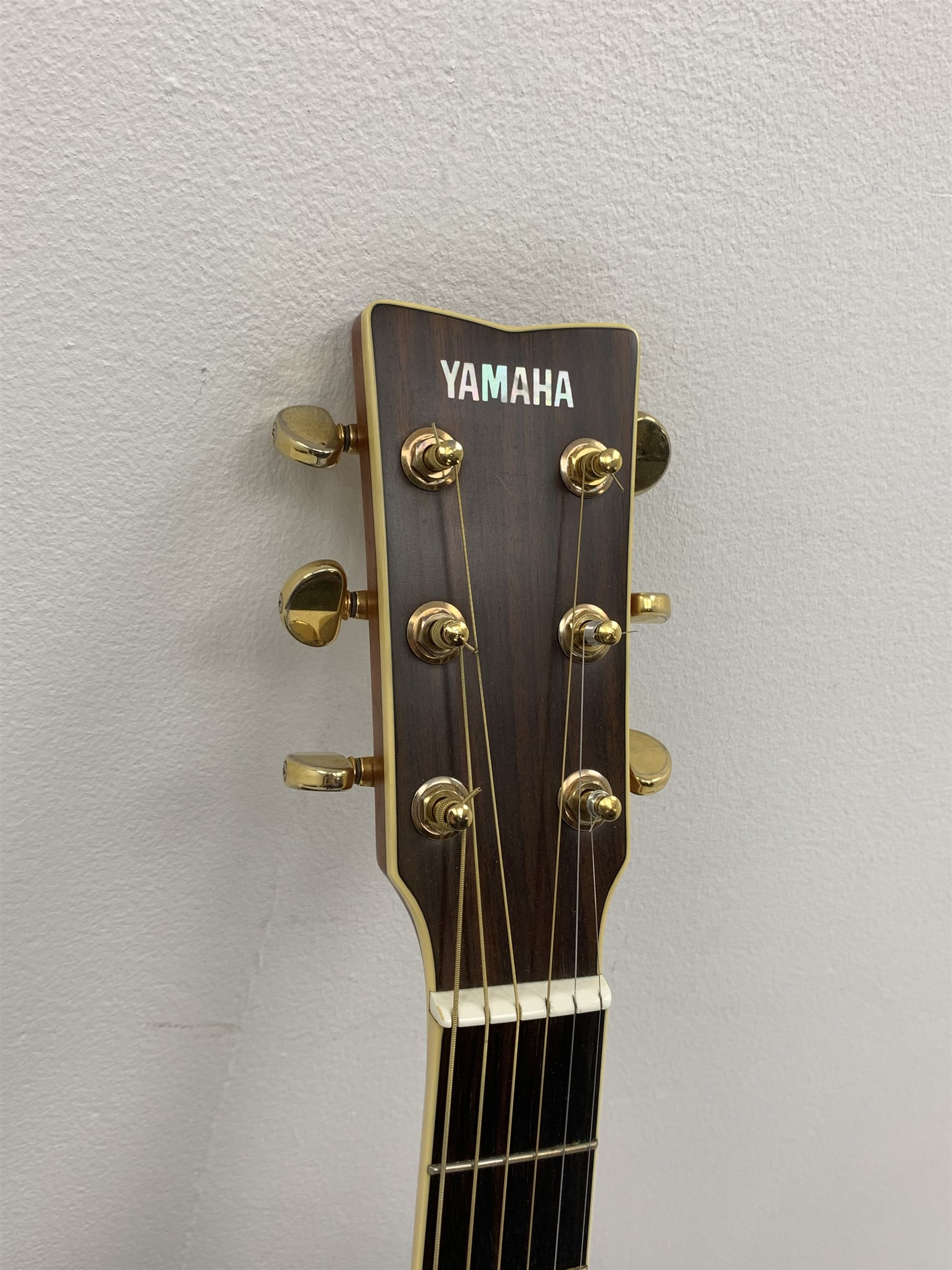  Yamaha model LLX6A acoustic/electric guitar with rosewood back and sides and spruce top, fitted with Yamaha tuner, serial no. QPH150011, L104cm, in hard carrying case. From the collection of the late John Burgess of Beverley who played in the bands Penjants, Wine, Strollers, Revox, Sound Foundation, Pickle Belly Alley, Ragamuffins and Jerryattricks.