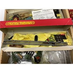 '00' gauge - four controllers including boxed H&M Duette, unmade construction kits, boxed Tri-ang engine shed and gatekeepers hut, scale motor vehicles, two boxed signal control sets, layout and trackside accessories including boxed trees, plastic construction kits etc, boxed Merit Station Accessories, figures etc