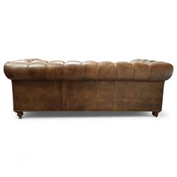 Timothy Oulton, Halo - late 20th century brown leather Chesterfield settee, the upholstered frame with deep buttoning to back and arms, large scroll terminals with brass studwork, twin seat cushions, raised on castored legs
