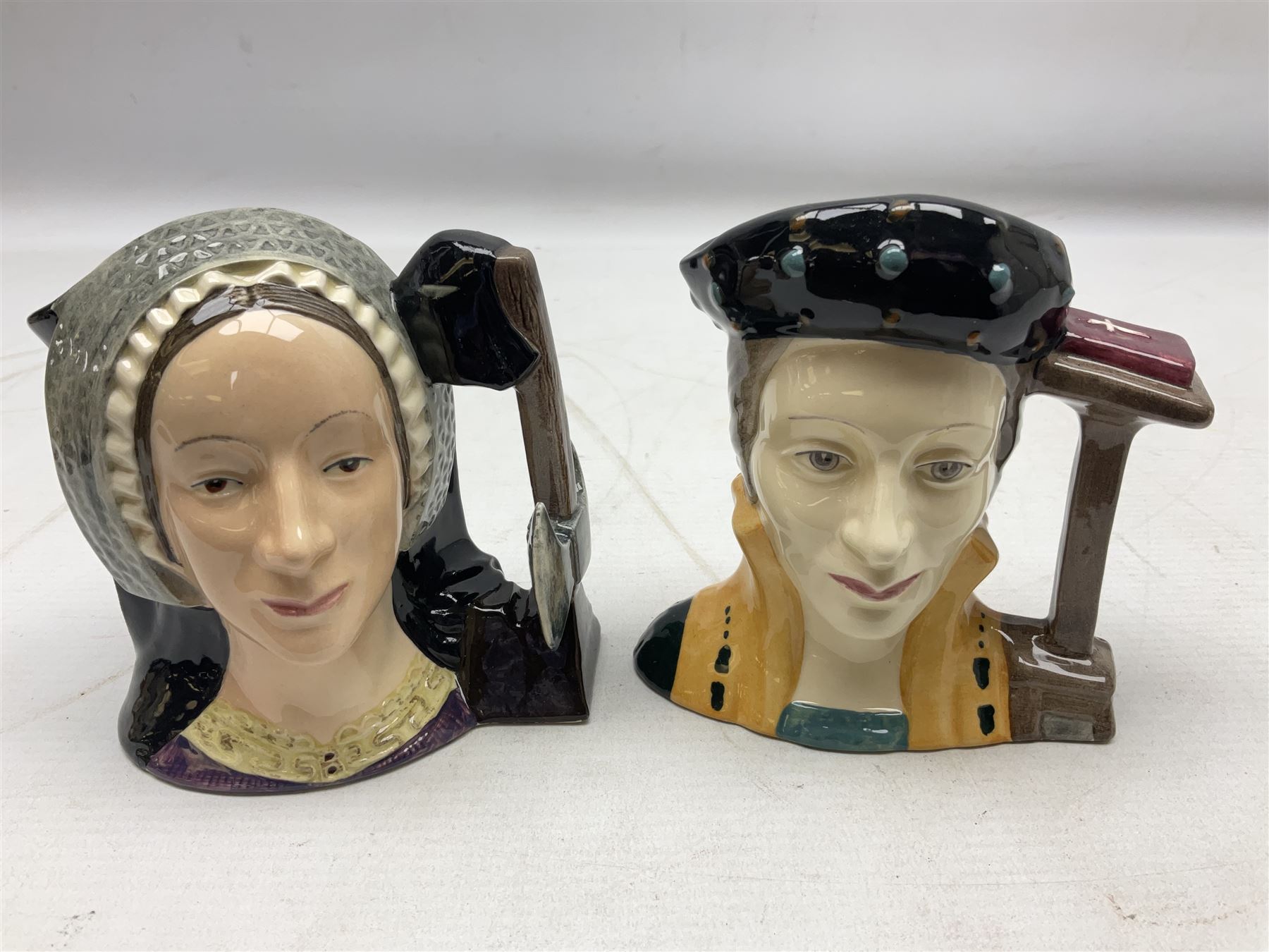 Royal Doulton Henry VIII and his Six Wives Character Jugs, comprising of Henry VIII D6647, Catherine of Aragon D6657, Anne Boleyn D6650, Jane Seymour D6746, Anne of Cleves D6753, Catherine Howard D6692 and Catherine Parr D6751, tallest H10cm
