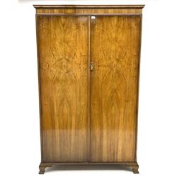 Waring and Gillow - early to mid 20th century figured walnut Gentleman’s wardrobe, two doors enclosing various compartment, mirror, drawers and hanging space, labelled 