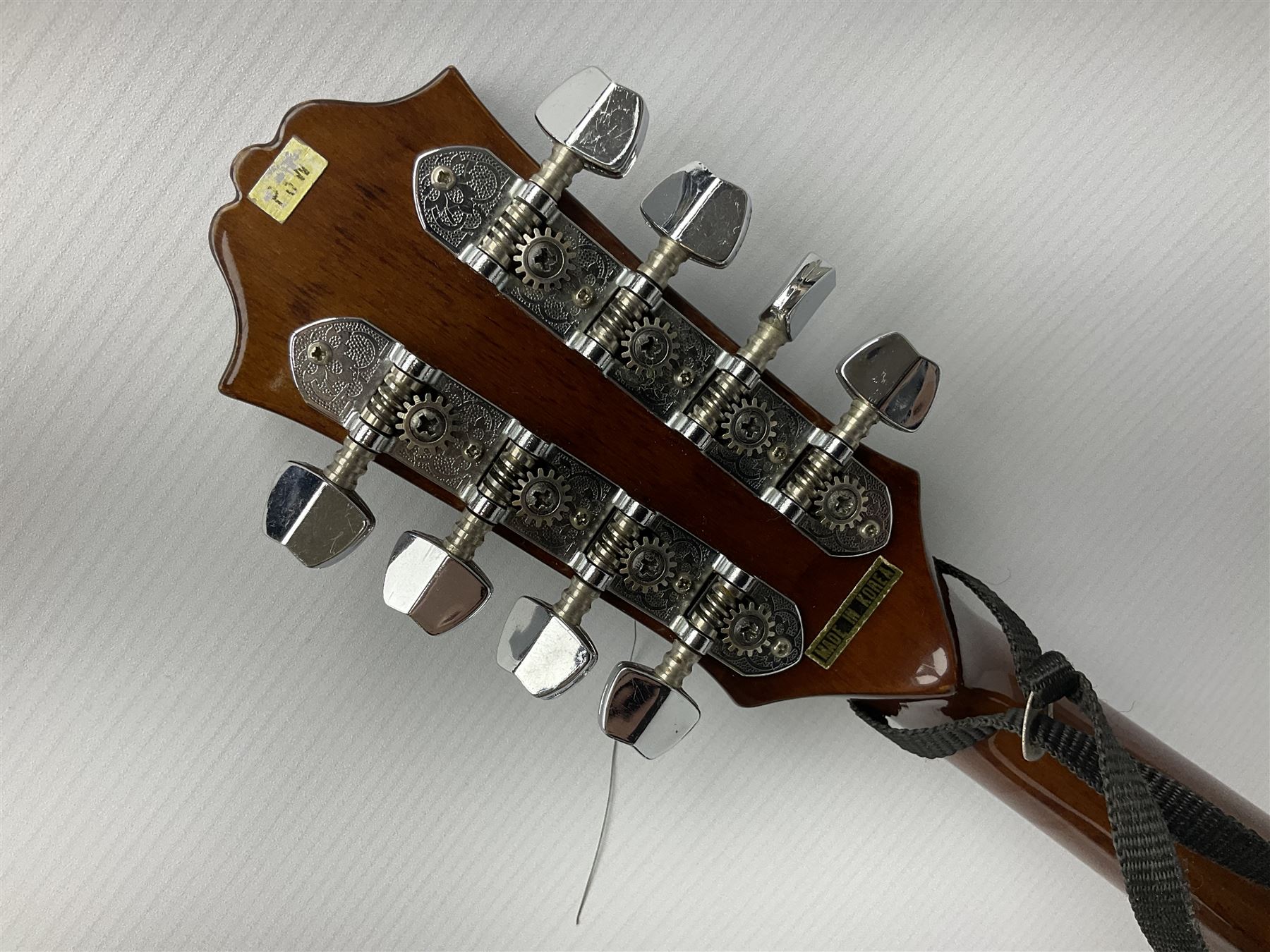 Palmer eight-string mandolin with mahogany back, simulated ivory and mother-of-pearl mounts L67cm; and Mahalo mahogany cased baritone scale ukulele, model no.U320B, L76cm; in hard carrying case (2)