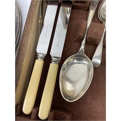 A wooden cased canteen of Sheffield silver plated cutlery for six place settings, along with a collection of metal ware, teapot, sugar bowl and milk jug on an oval tray and ladle. 