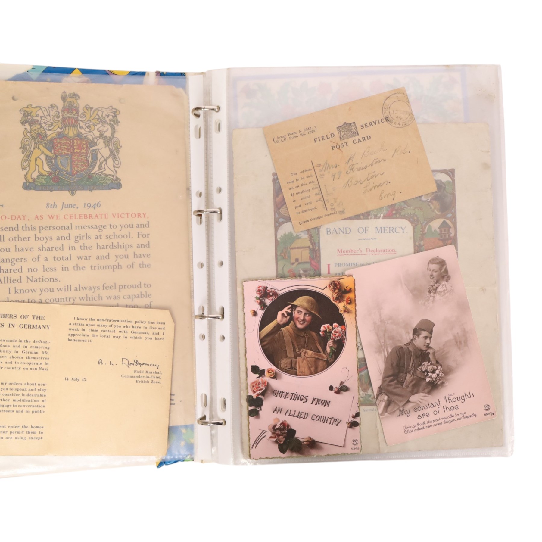 Collection of WWII ephemera, including photographs, postcards, identification cards, telegrams, newspapers 