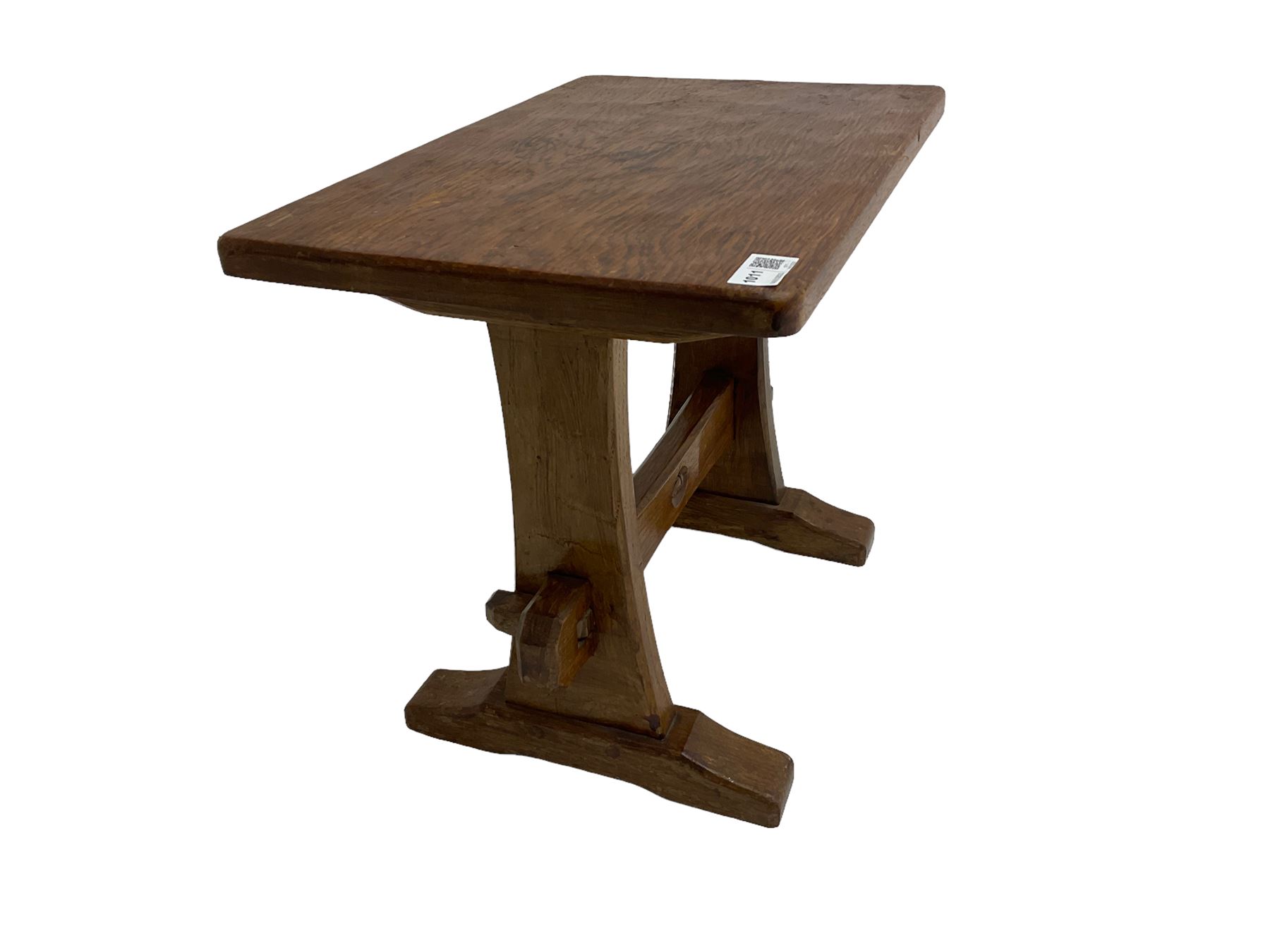 Acornman - oak occasional or side table, rectangular adzed top on shaped end supports joined by pegged stretcher on sledge feet, by Alan Grainger of Brandsby