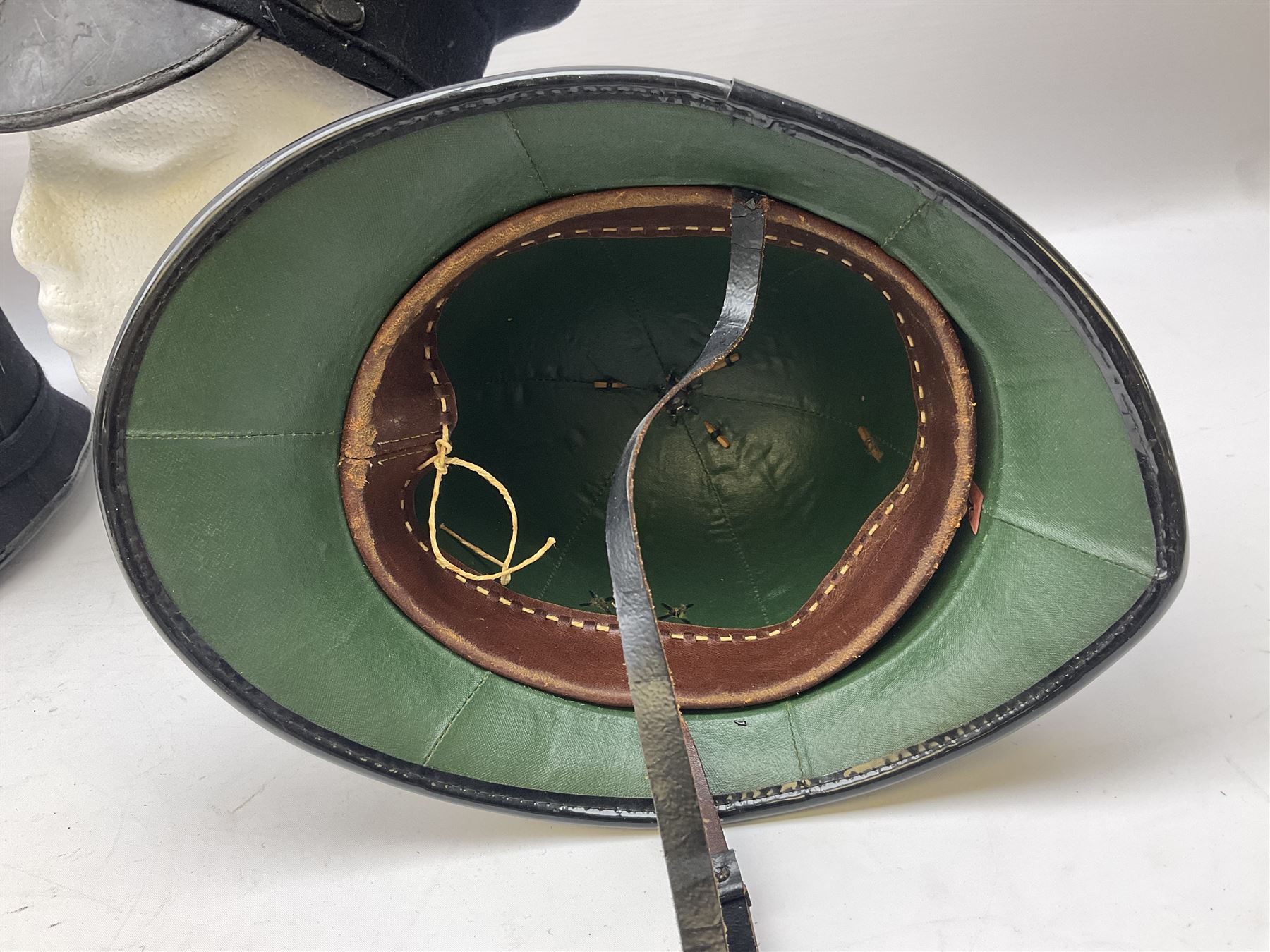 Hull City Police - helmet with king's crown night plate; two further ball-top helmets with Queen's crown plates; and a peaked cap (4)