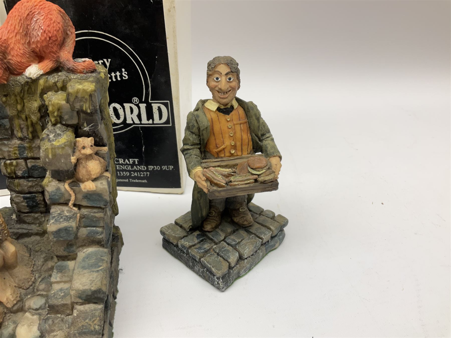 Terry Pratchett Discworld figures, designed by Clarecraft, comprising Rincewind and Luggage bookend DW41, Imp Y Celyn, DW81, C.M.O.T Dibbler, DW35, Rincewind, DW01 and Susan Sto Helit, boxed, DW77