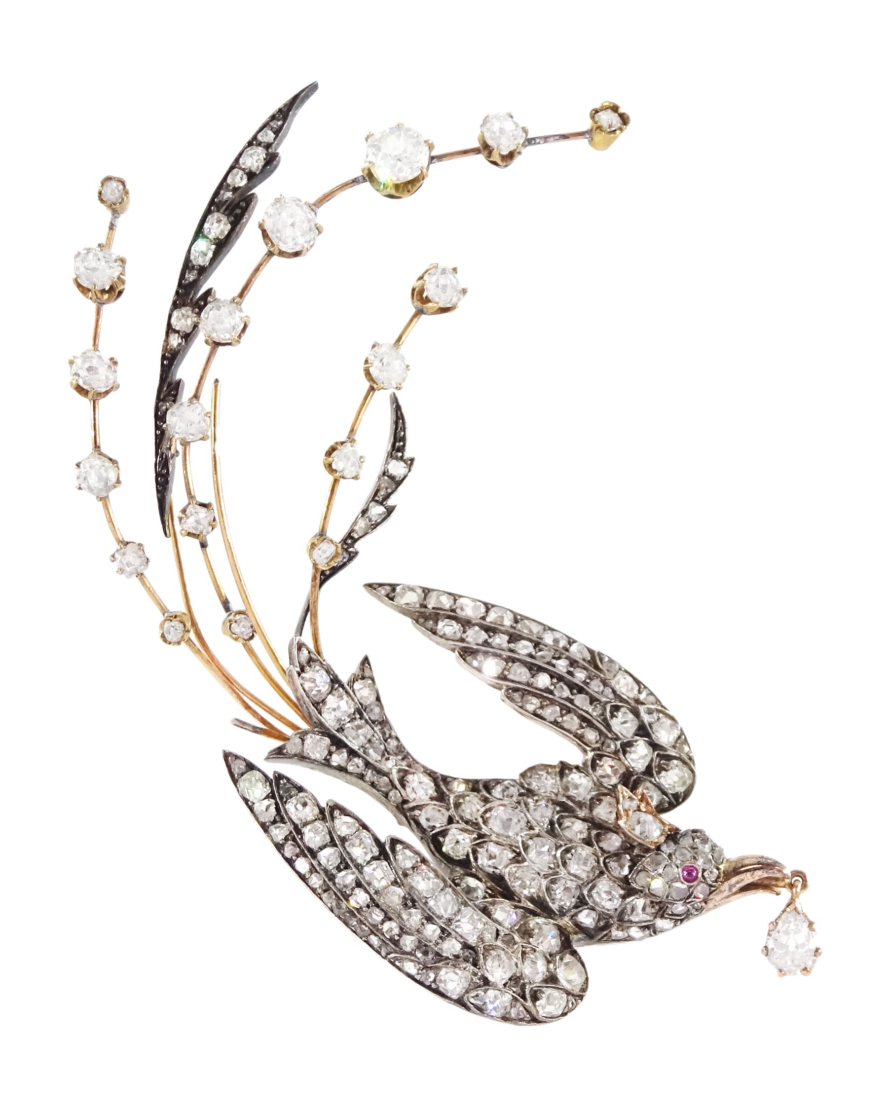 Victorian diamond swallow aigrette brooch, the gold backed silver swallow in flight set with old cut and rose cut diamonds, with cabochon ruby eyes, holding a pear cut diamond of approx 0.25 carat, to an old cut diamond spray tail of approx 1.95 carat, total diamond weight approx 4.00 carat