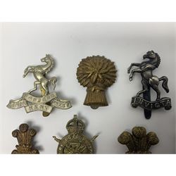 Nineteen Yeomanry metal cap badges including Derbyshire, Northamptonshire, Essex, Glamorgan, Staffordshire, City of London, Surrey, Shropshire, Hertfordshire etc; together with eleven Fusiliers badges including Lancashire, Royal Welch, Northumberland etc (30)