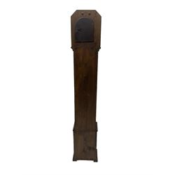 1950’s - 8-day oak cased grandmother clock, flat top with chamfered corners, long trunk with applied beadwork decoration, rectangular plinth raised on bracket feet, circular silvered dial with Arabic numerals and spade hands, three train Westminster chiming movement chiming the quarters and hours on 8 gong rods. With pendulum.  