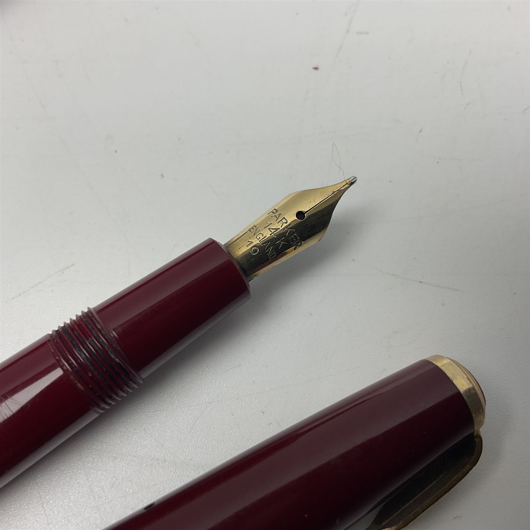 Four fountain pens, each with 14ct gold nibs, comprising Mentmore Paramount, Parker Junior Duofold, Conway Stewart marbleised pen and Waterman's, together with a 14ct gold Conway Stewart 5B nib