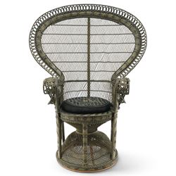 Mid-20th century wicker and rattan Peacock chair in unusual tones of dark olive and black, high fan back with a pieced and woven frame terminating to scrolled arms, with loose seat cushion