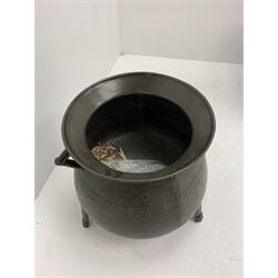 Late 17th/early 18th century bronze cauldron, of bellied form with flared rim and twin angular handles, upon three ribbed outswept feet, detailed with a decorative band beneath four arc founder's mark for John Sturton (I or II) of South Petherton, Somerset and a capital 'I', H40cm, rim D36cm