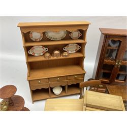 Doll's house wooden furniture - over twenty items including good quality pine Welsh dresser by Tony of Lincoln; tall 'glazed' bookcase; two-tier side cabinet; grand piano; bedside chest, mule chest, Canterbury; cradle; Georgian style hanging corner cupboard; dumb waiter; tables; chairs; rocking chair etc; various scales