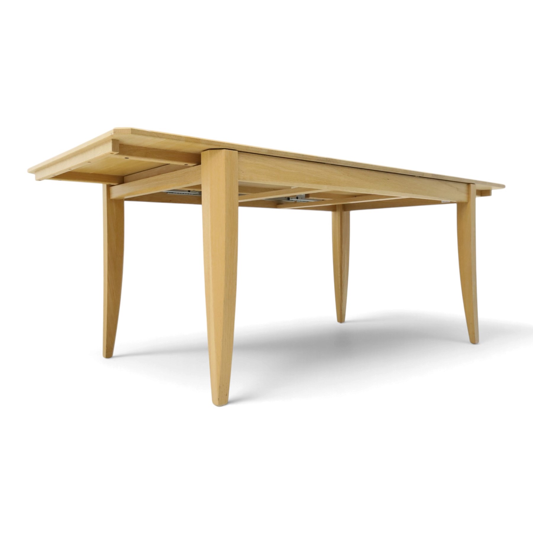 Ercol - 'Artisan' light oak extending dining table, rectangular top with canted corners, with stowable leaf extending the table to 193cm, shaped faceted supports