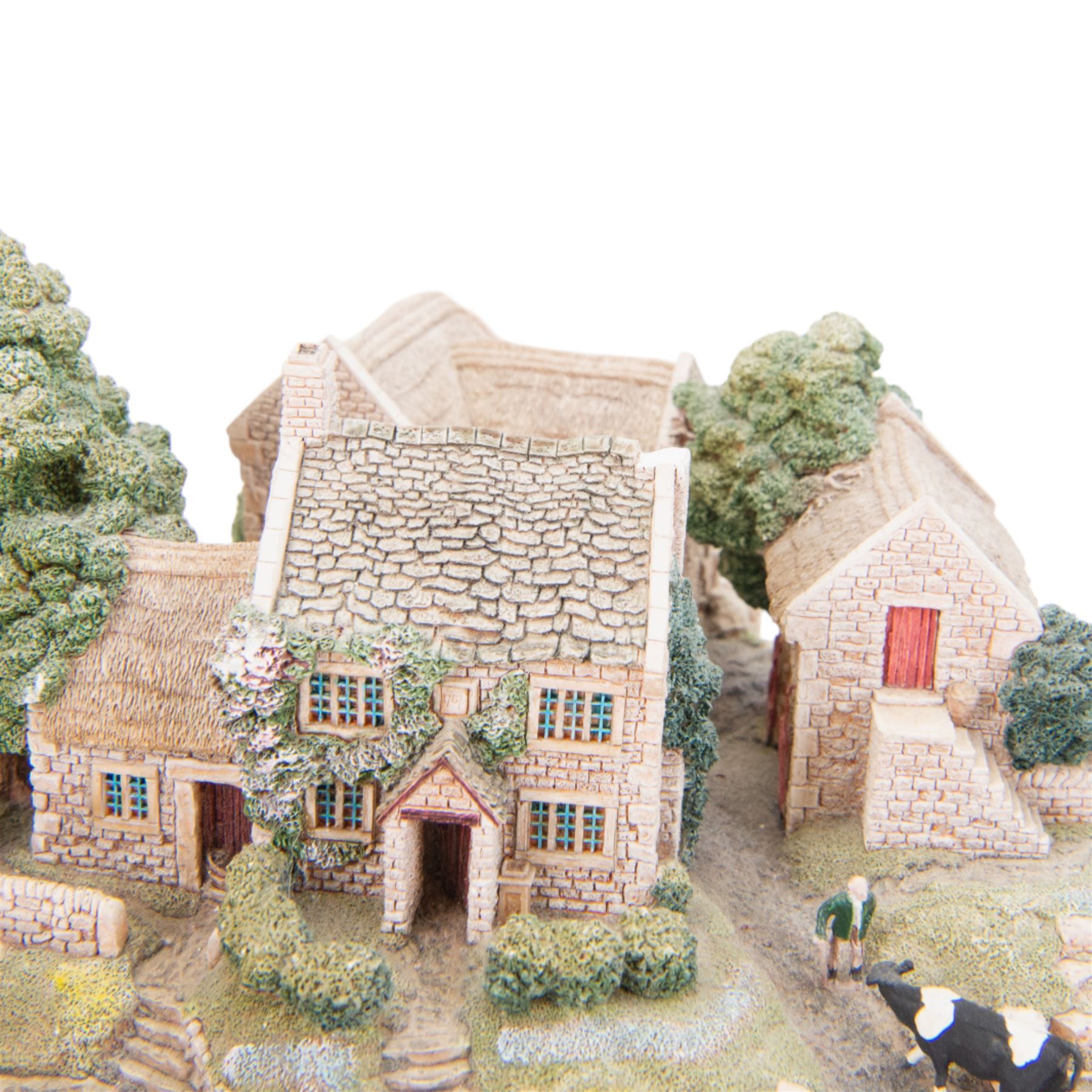 Four Lilliput Lane models, comprising Oakwood Smithy, We Plough the Fields and Scatter, Bluebell Farm and Highghyll Farm
