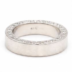 Platinum diamond wedding band, each side set with twenty-eight round brilliant cut diamonds, Sheffield 2000, total diamond weight approx 0.55 carat