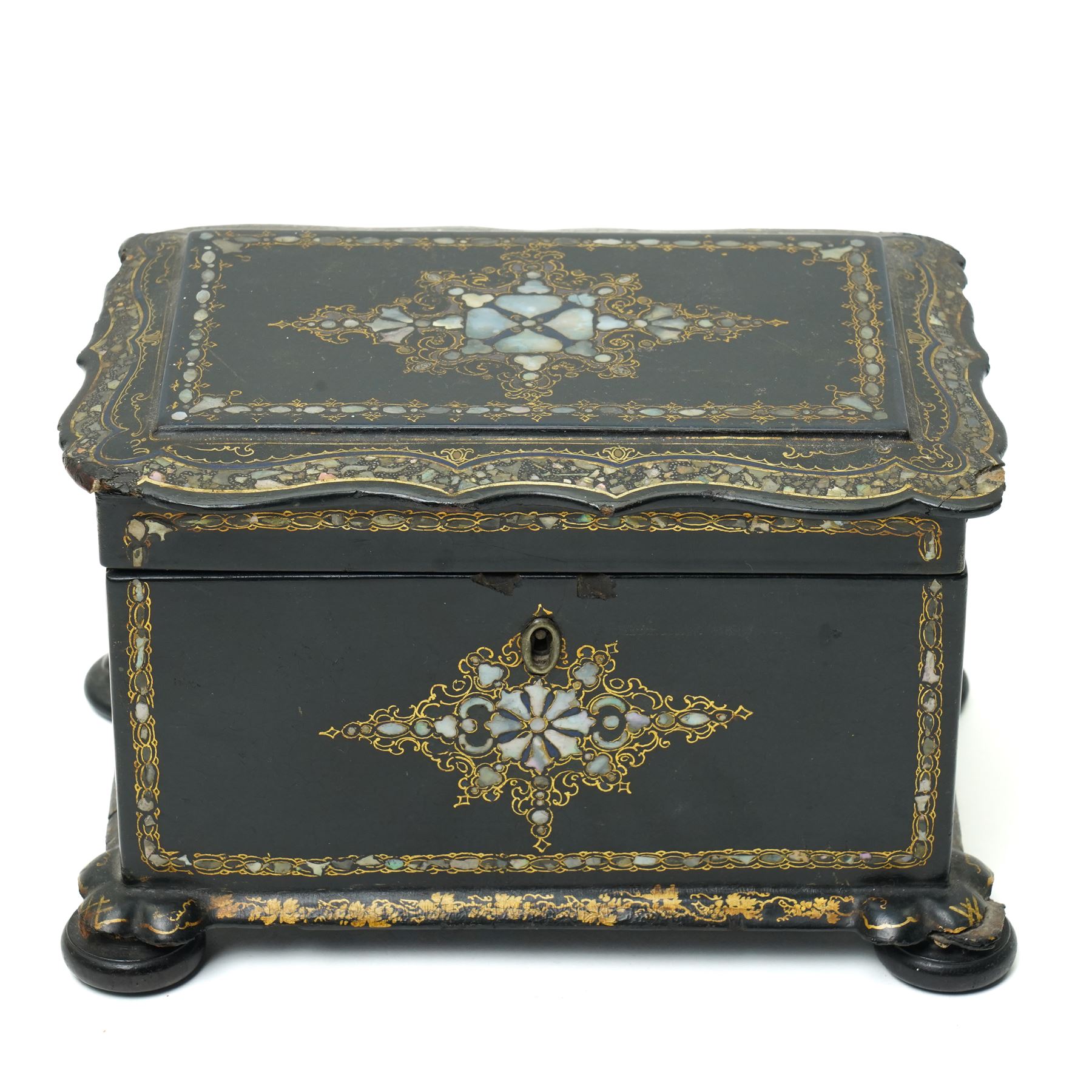 Victorian papier mache tea caddy inlaid with mother of pearl and gilt on compressed bun feet W20cm