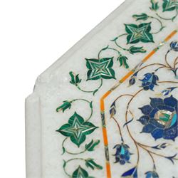 20th century Florentine design composite marble pietra dura centre table, octagonal white marble top inlaid with a polychrome foliate and floral medallion centred by a rosette, within a conforming floral border, raised on a faceted octagonal marble pedestal and stepped base