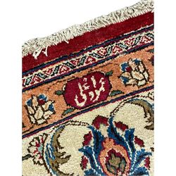 North East Persian signed meshed carpet, the red ground field with interlacing branch design and decorated with plant motifs, ivory ground border with similar repeating design, the guard bands decorated with flower heads, signature panel to one end