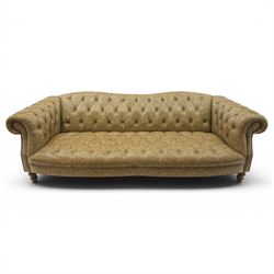 Tetrad - 'Matisse' grande three-seat sofa, Chesterfield shape with rolled arms flanking a serpentine back and front, upholstered in buttoned tan leather with close-nailed studwork, on turned feet