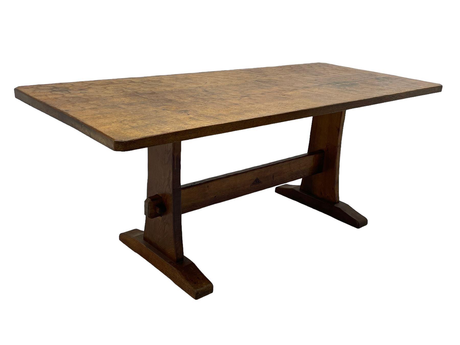 Yorkshire Oak 'Kingpost' - oak dining table, rectangular adzed top on tapered end supports, united by pegged stretchers carved with kingpost signature, on sledge feet, by Robert Ingham, Burton Leonard, Harrogate 