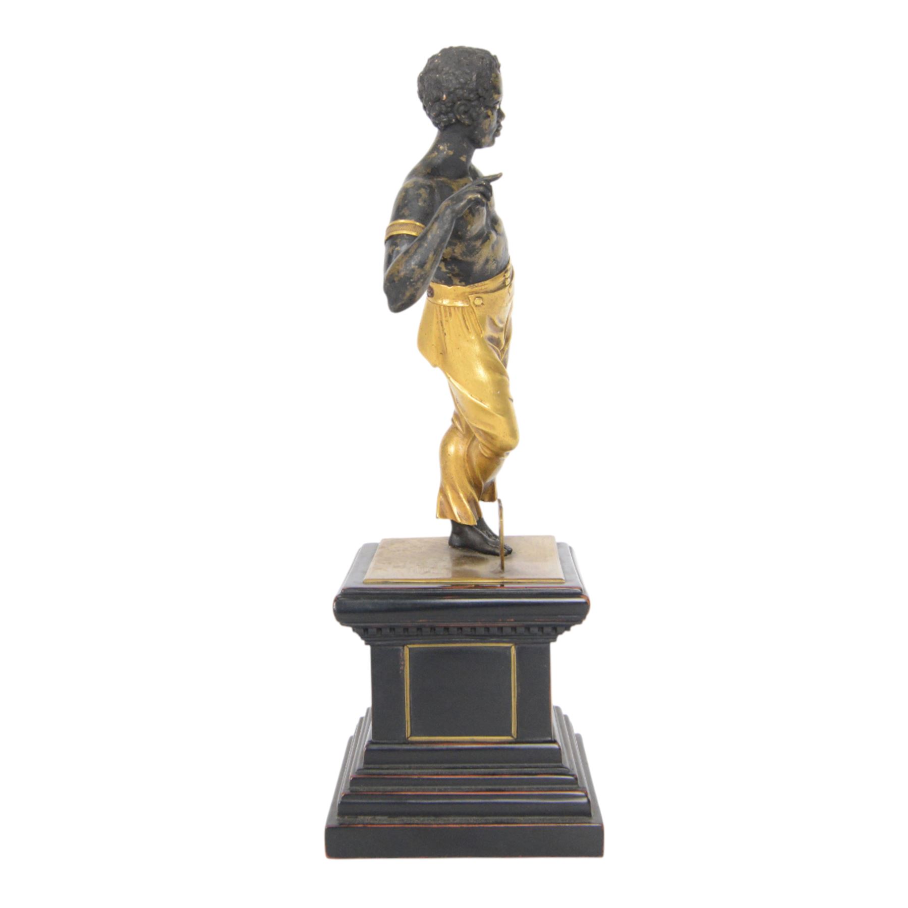 19th century brass finished, and gilded figure, probably originating from a clock, now set on associated base, H36cm

Note: Comparable figure sold Christies, Interiors sale, including the collection of the late Serge Baillache, 20 May 2014, lot 252