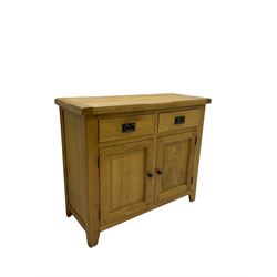 Solid light oak sideboard, fitted with two drawers and two cupboards