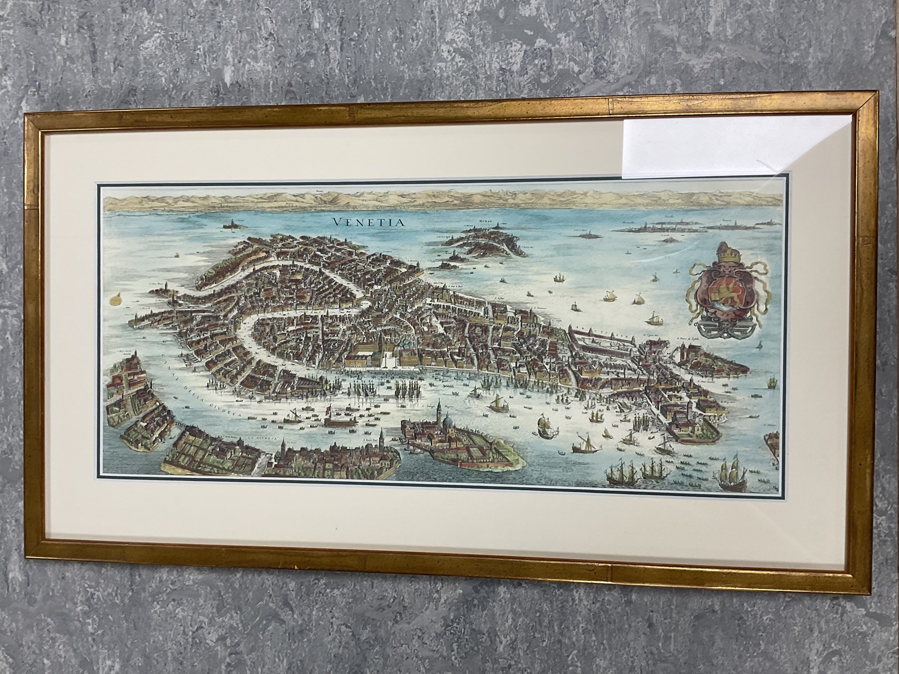 Collection of pictures, to include After William Callow (British 1812-1908): Continental River Scene, coloured lithograph; English School (20th century): Church Ruins on the River, watercolour unsigned; Christopher Gifford Ambler (British 1886-1965): Ceasar's Wife - A Matter of Colour, coloured print signed in pencil; after Francis Nicholson (British 1753-1844): Newbrough Gate 1834, monochrome lithograph; Map of Venice, coloured print, with others and one mirror, max 40cm x 49cm (18)