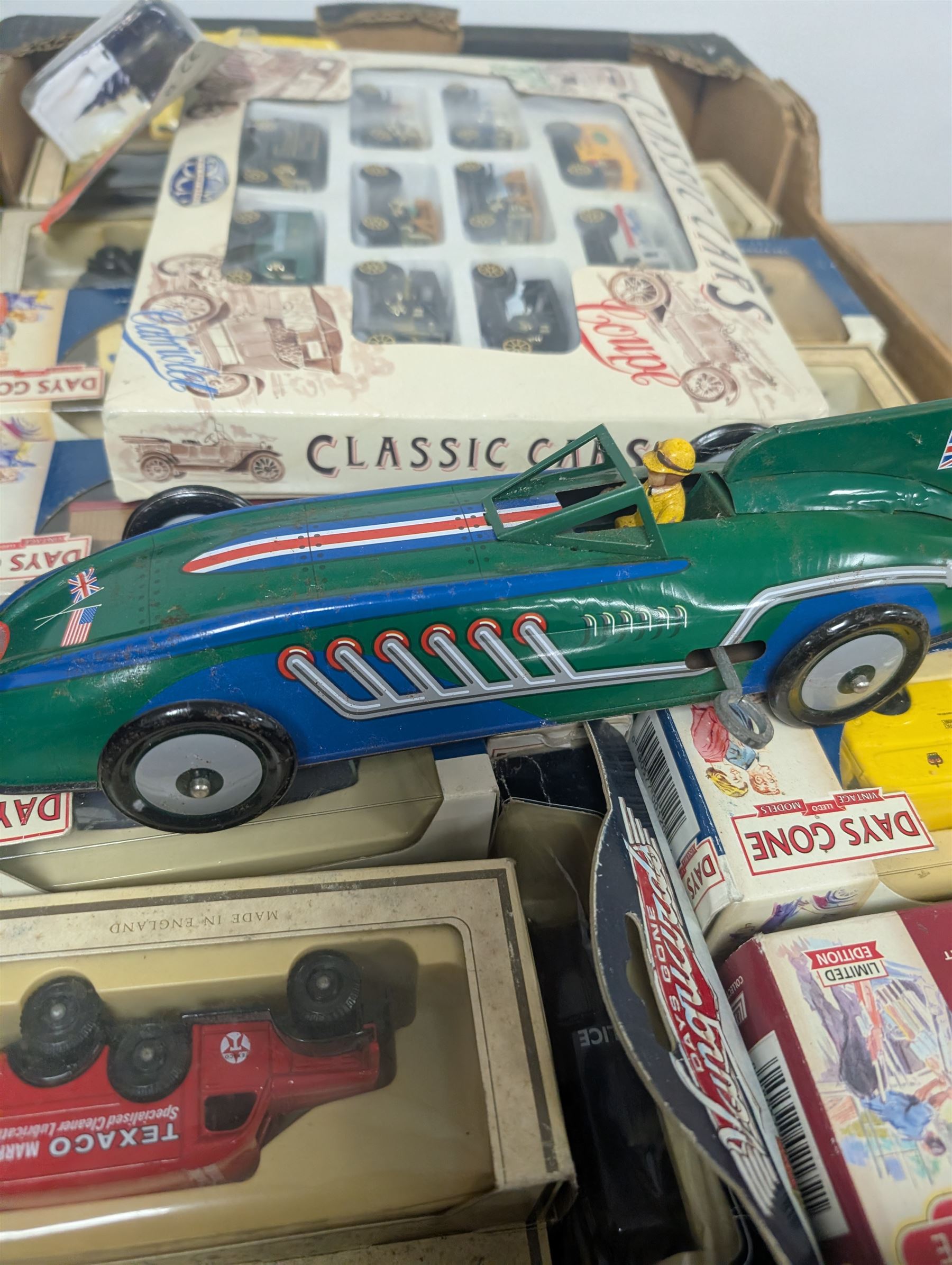 Collection of diecast model vehicles, including Corgi Super Haulers Pickfords lorry, Corgi Bedford Coach, Lledo Days Gone and Trackside models two Maisto motorcycles, etc, all boxed together with a St Johns tinplate Land Speed Record clockwork car