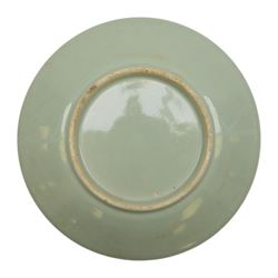 19th century Chinese Canton export celadon ground famille rose charger, of circular dished form decorated with a central panel of figures in a court setting, within a border of blossoms, birds and butterflies, D34.5cm