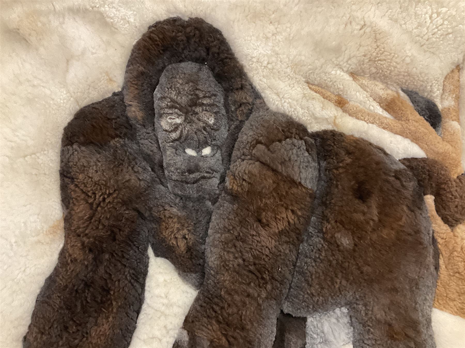 Alpaca rug/wall hanging depicting a gorilla on a cream background 