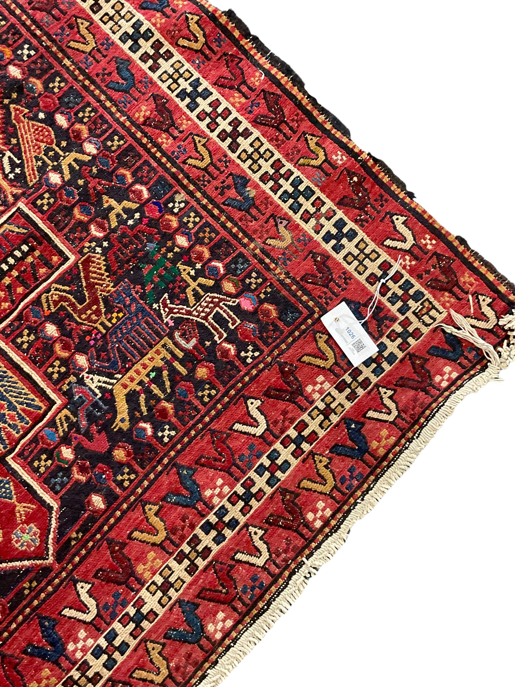 North African flat-woven rug, decorated with small stylised animal and bird motifs, five geometric star medallions