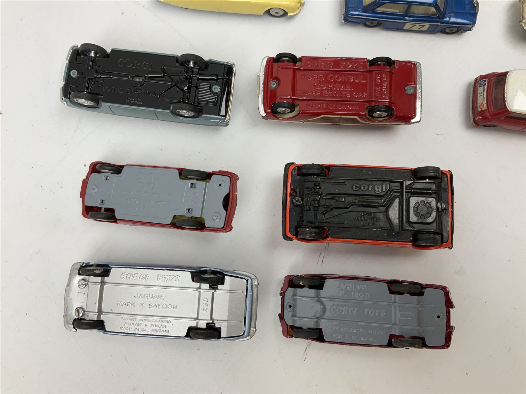 Corgi - thirty unboxed and playworn/repainted die-cast cars including Triumph Herald Coupe, BMC Mini-Cooper 'S', Porsche Carrera, two 'E' Type Jaguars, Rover 2000TC, three Morris Minors, two Aston Martin DB4, two Volvo P1800, MGA, Fiat 2100, Jaguar 2.4 Litre, Jaguar Mark X Saloon etc (30)