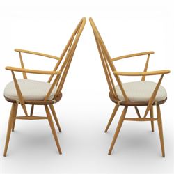 Ercol - elm dining chairs, set of six including two armchairs, arched spindle backs over shaped elm seats with upholstered pads, tapering beech legs joined by stretchers
