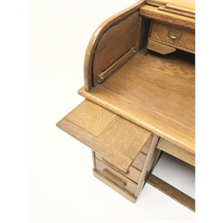 Early 20th century light oak twin pedestal tambour roll top desk, fitted interior, two slides, single frieze flanked by eight drawers, plinth base, W122cm, H101cm, D68cm  
