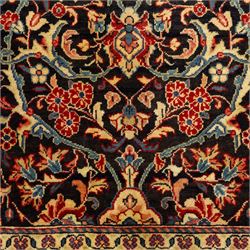 North West Persian Hamadan hand-knotted runner, deep navy field with central stylized medallion with pendants, surrounded by angular floral motifs, within an ivory border of repeating rosettes and stylized leaves, enclosed by guard stripes, fringe ends 