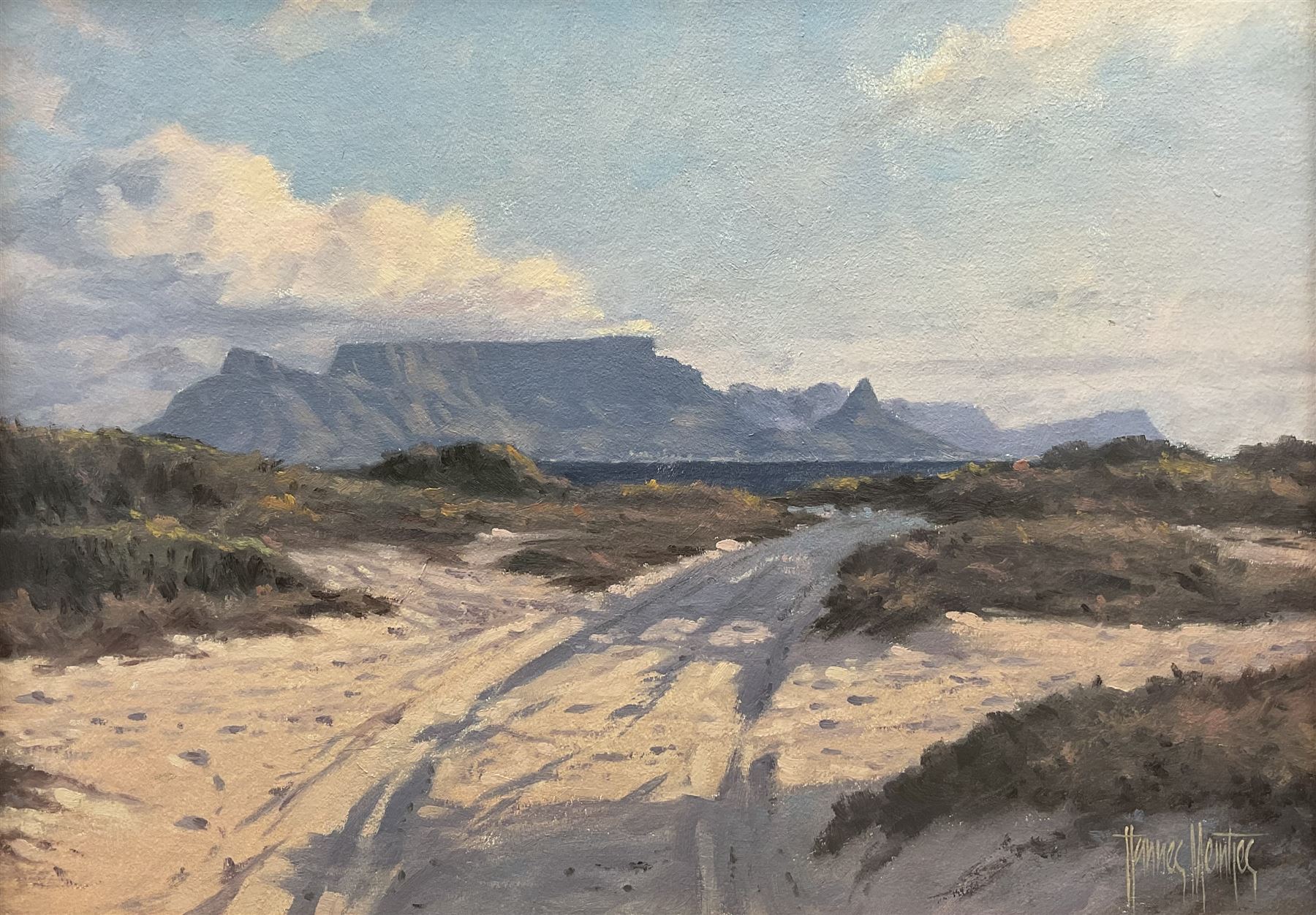 Hannes Meintjes (South African 1944-): Road towards the Mountains,  oil on canvas mounted on board signed 29cm x 49xm 