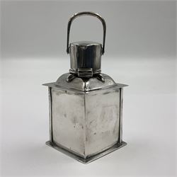 Early 20th century silver novelty inkwell, modelled as a ship's port lantern, with swing handle, convex red glass panel and hinged cover opening to reveal a glass liner, hallmarked Samuel Jacob, London 1911, height not including handle H8.5cm